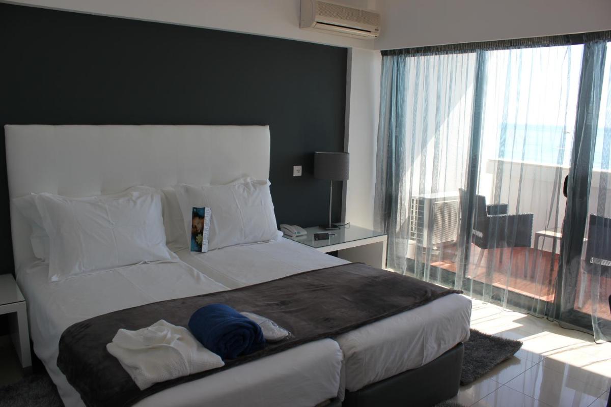Uma cama ou camas num quarto em Rocamar Exclusive Hotel & Spa - Adults Only