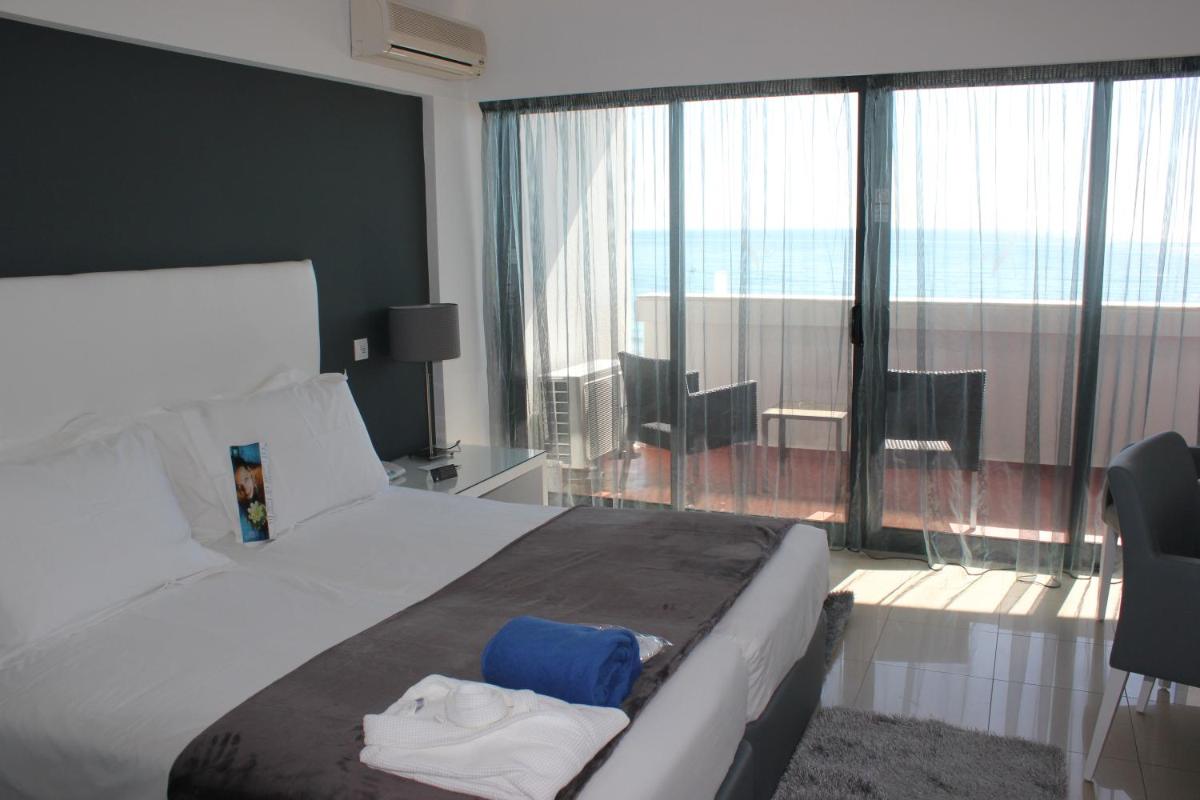 Uma cama ou camas num quarto em Rocamar Exclusive Hotel & Spa - Adults Only