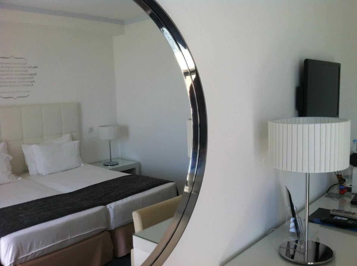 Uma cama ou camas num quarto em Rocamar Exclusive Hotel & Spa - Adults Only