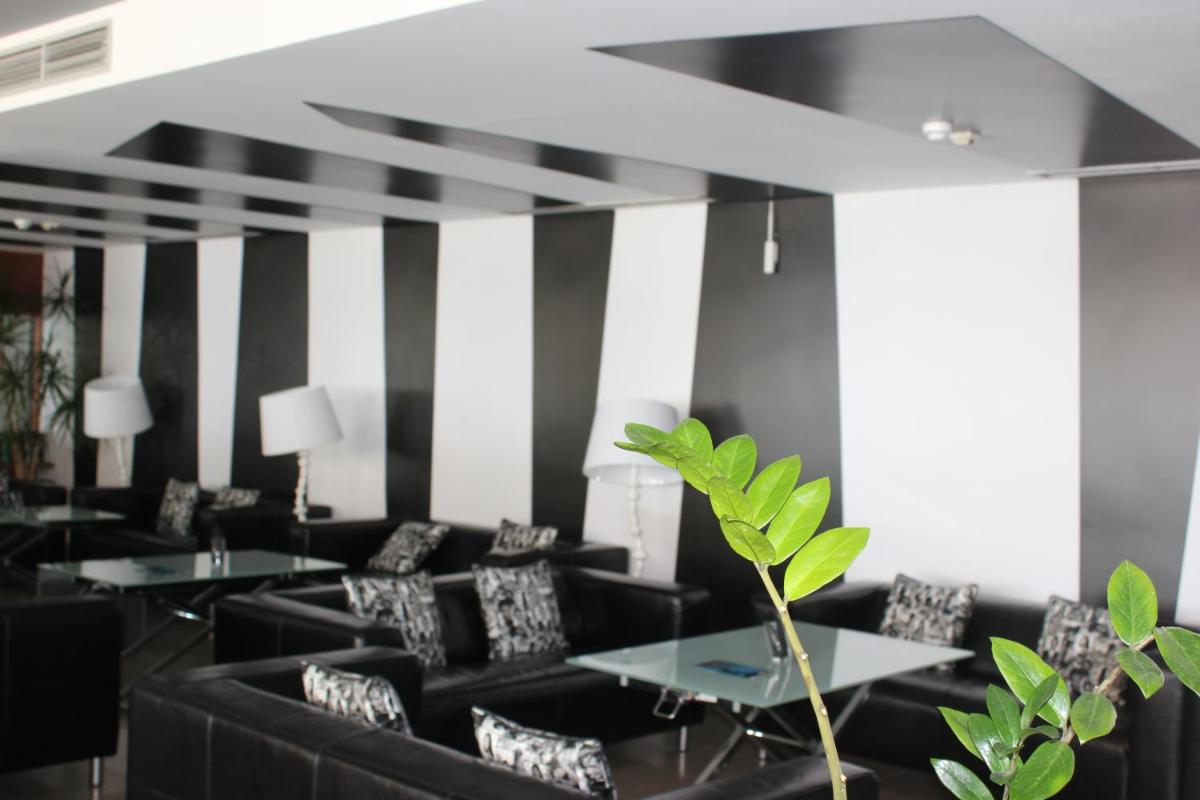 Uma área de estar em Rocamar Exclusive Hotel & Spa - Adults Only
