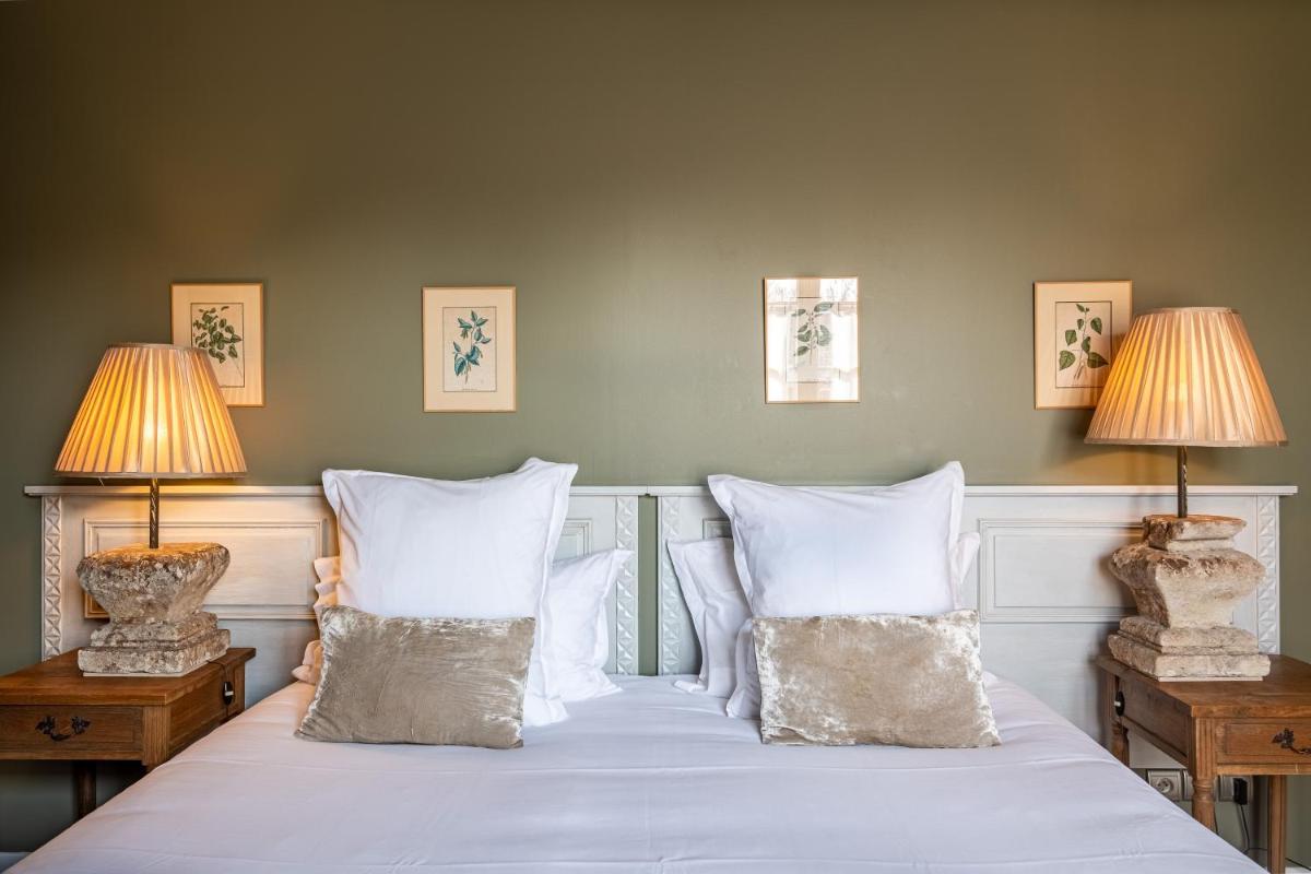 Un ou plusieurs lits dans un hébergement de l'établissement La Marine de Loire Hôtel & Spa