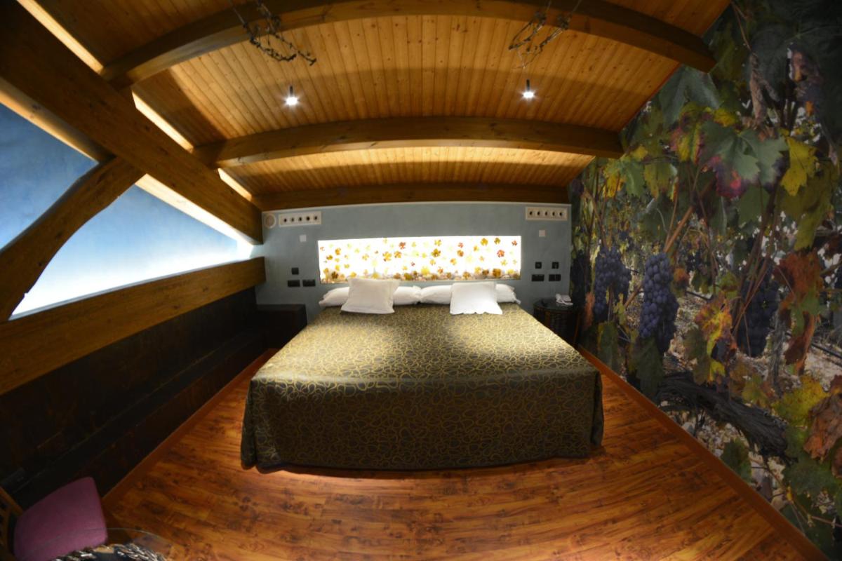 Cama o camas de una habitación en Hotel SPA El Lagar de Isilla