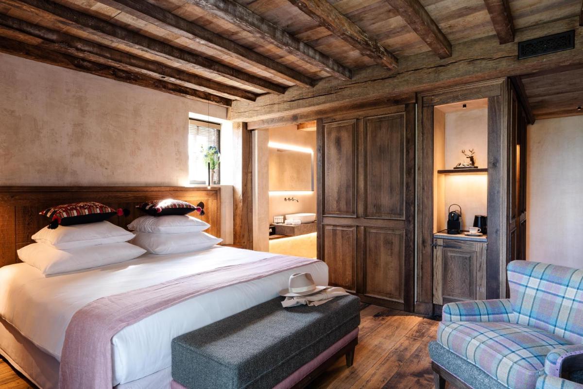 Un ou plusieurs lits dans un hébergement de l'établissement La Ferme Saint Simeon Hotel & Spa - Relais & Chateaux