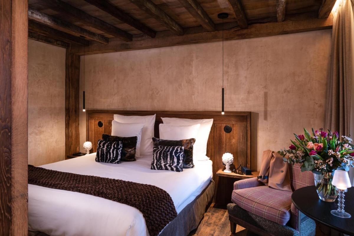 Un ou plusieurs lits dans un hébergement de l'établissement La Ferme Saint Simeon Hotel & Spa - Relais & Chateaux