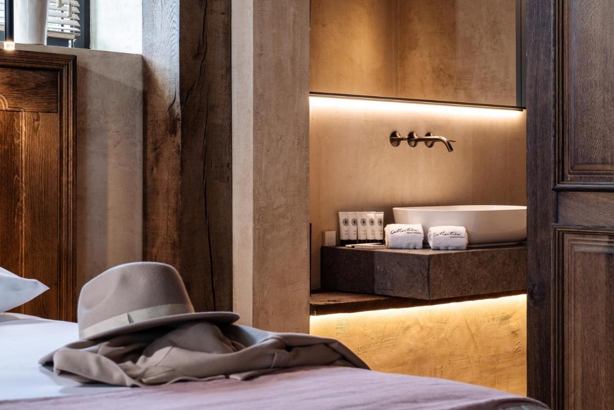 Un ou plusieurs lits dans un hébergement de l'établissement La Ferme Saint Simeon Hotel & Spa - Relais & Chateaux