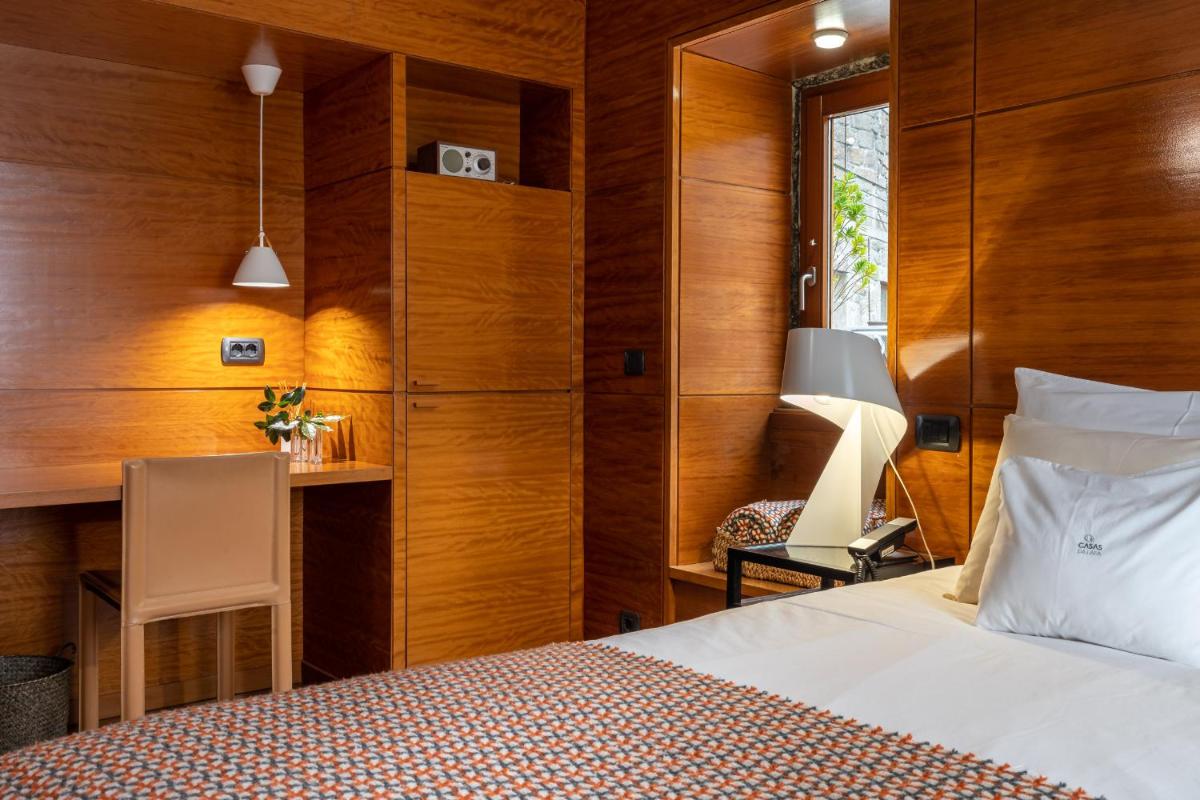 Uma cama ou camas num quarto em Casas Da Lapa, Nature & Spa Hotel