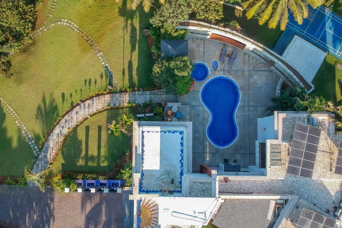 Our Beloved Summer by StayVista - Offering a swimming pool, expansive lawn, badminton court and indoor games - Housity