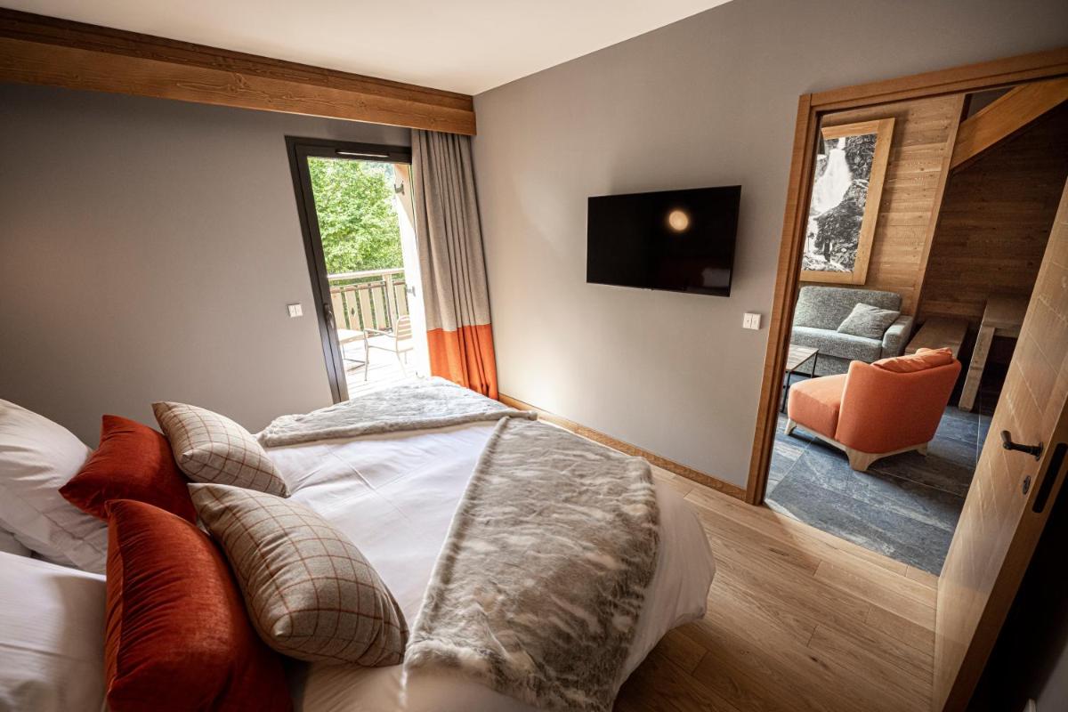 Un ou plusieurs lits dans un hébergement de l'établissement Pure Montagne Resort & Spa