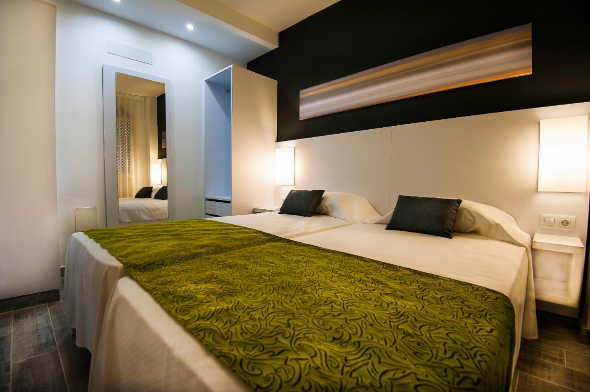 Cama o camas de una habitación en Kn Aparthotel Columbus