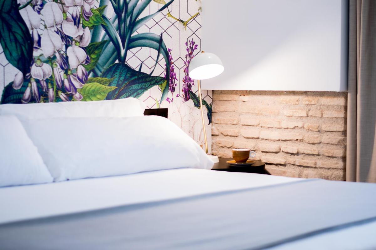 Cama o camas de una habitación en MYR Plaza Mercado & Spa