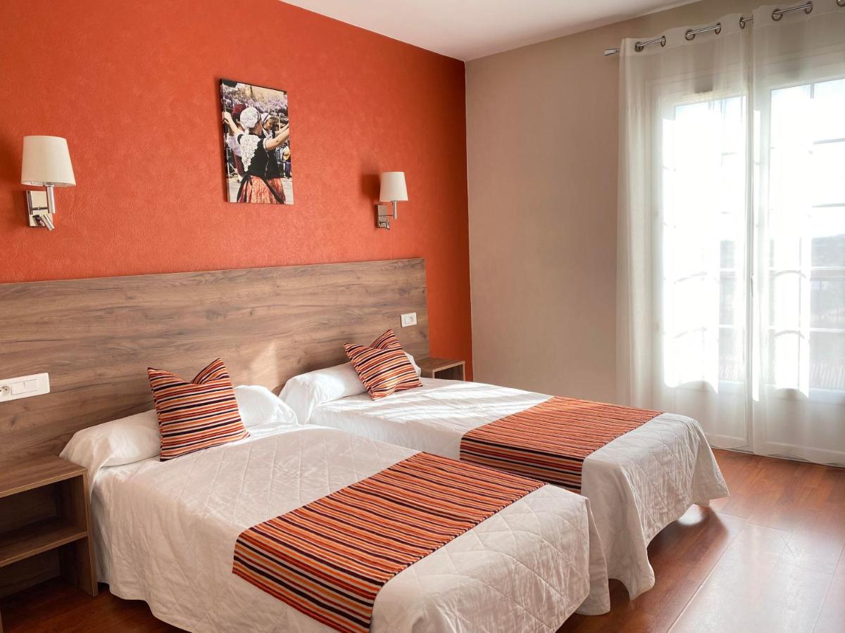 Un ou plusieurs lits dans un hébergement de l'établissement Hôtel Le Belvedere