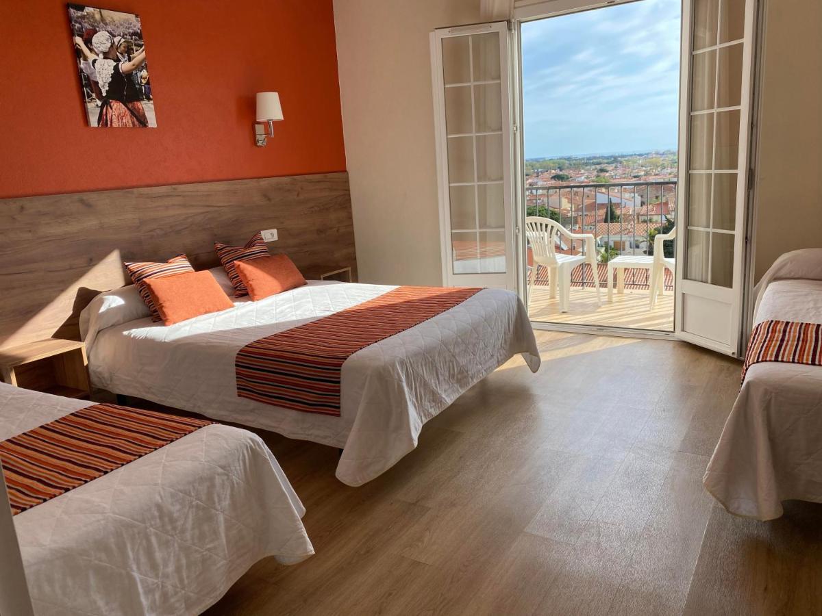 Un ou plusieurs lits dans un hébergement de l'établissement Hôtel Le Belvedere