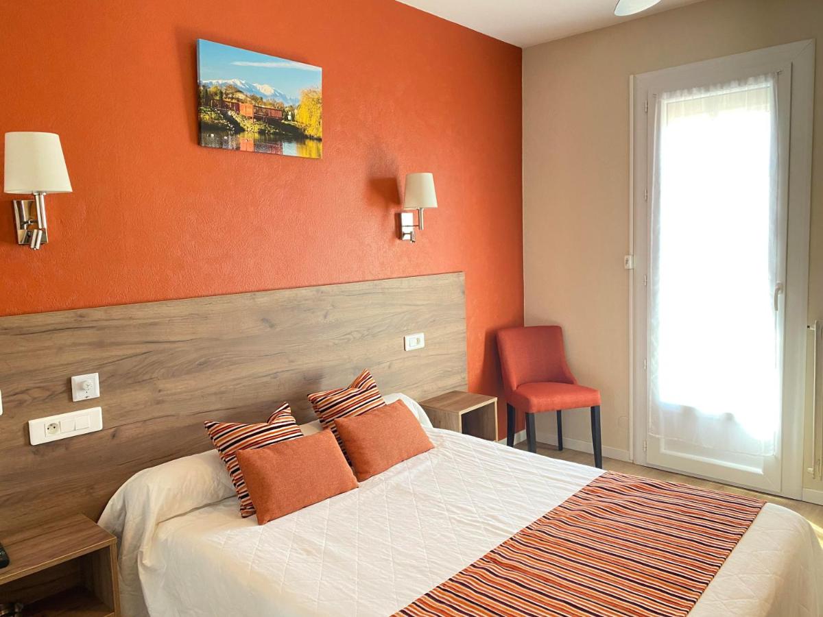 Un ou plusieurs lits dans un hébergement de l'établissement Hôtel Le Belvedere