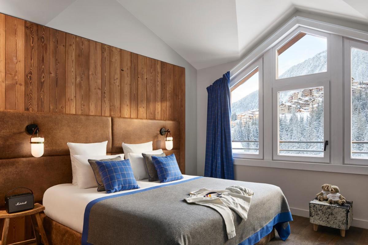 Un ou plusieurs lits dans un hébergement de l'établissement Ecrin Blanc Resort Courchevel - Aquapark