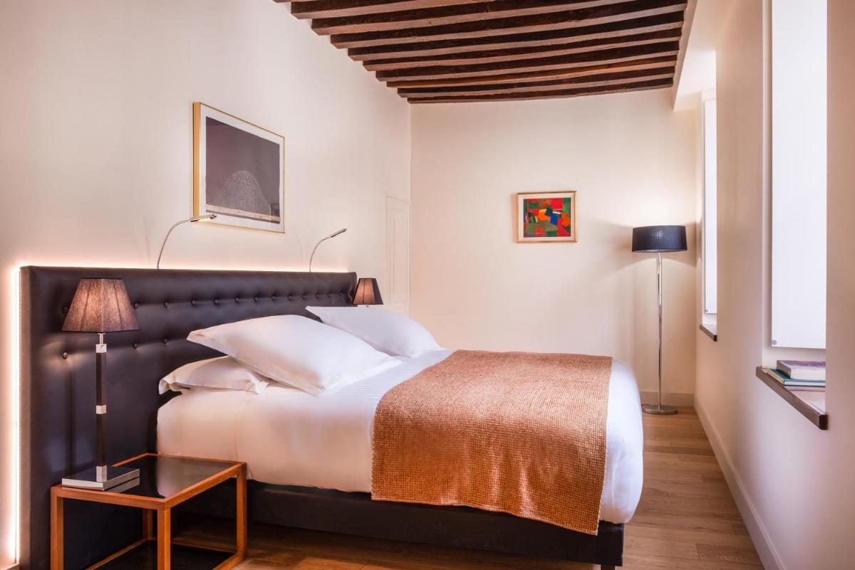 Un ou plusieurs lits dans un hébergement de l'établissement L'Hôtel