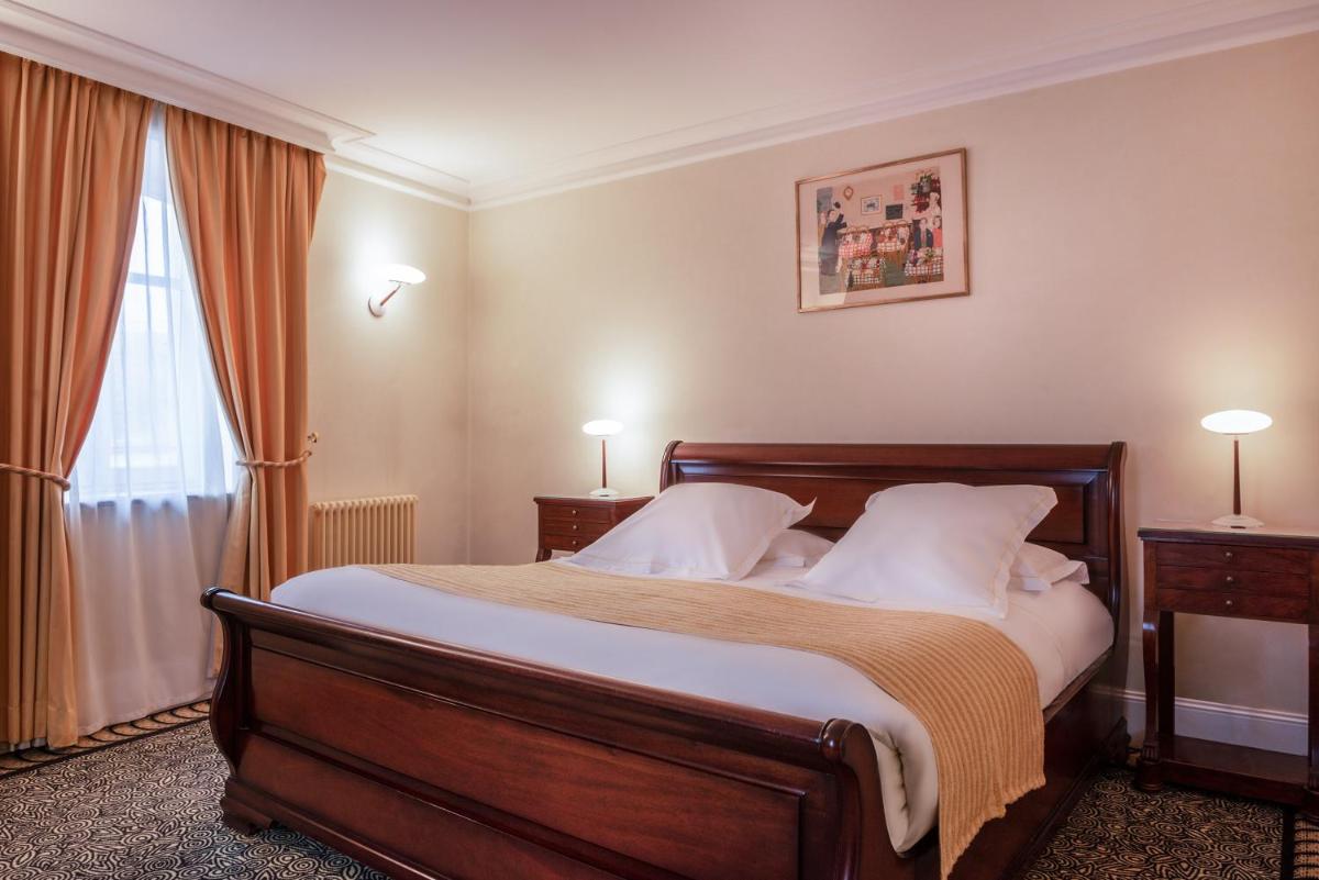 Un ou plusieurs lits dans un hébergement de l'établissement L'Hôtel
