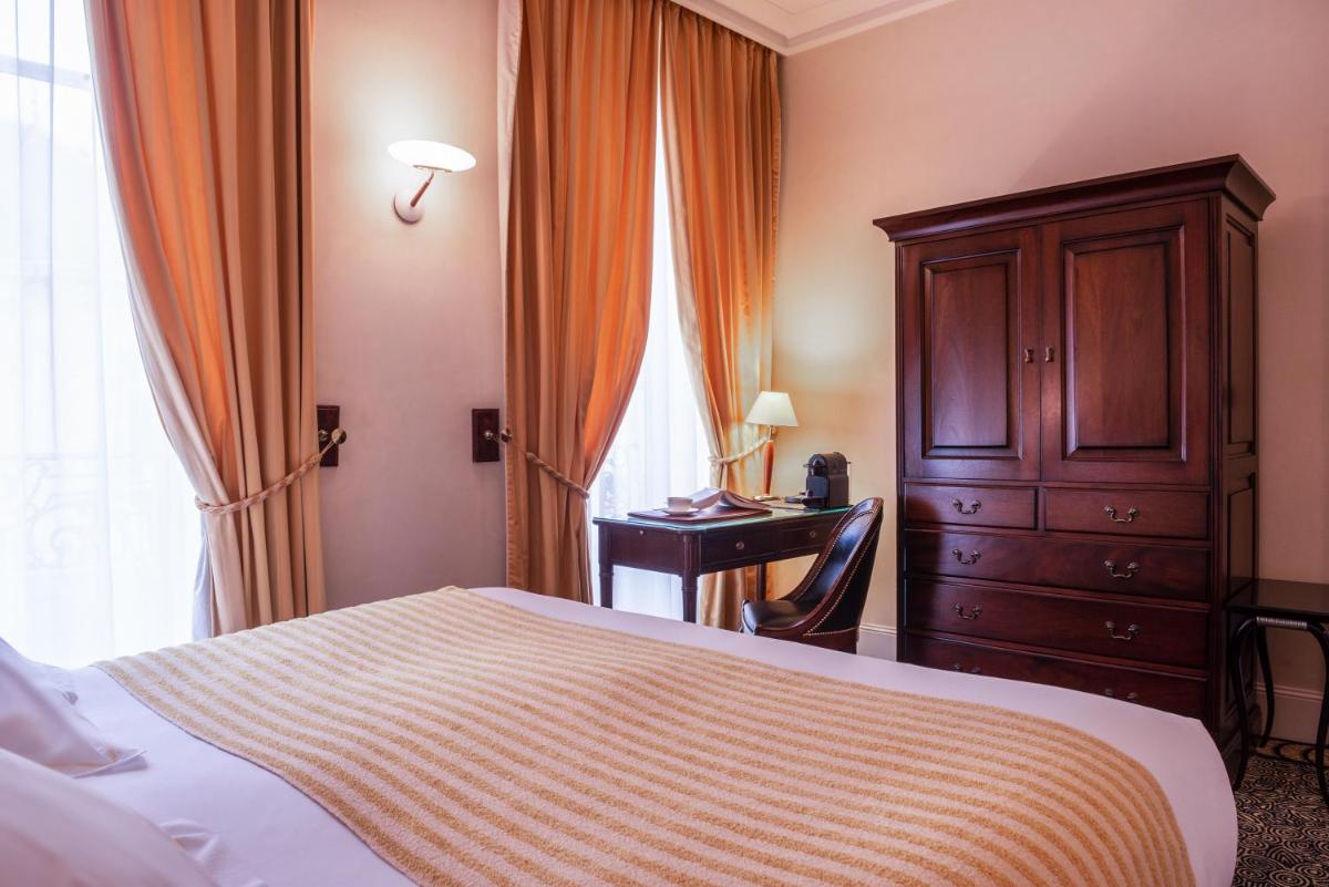Un ou plusieurs lits dans un hébergement de l'établissement L'Hôtel