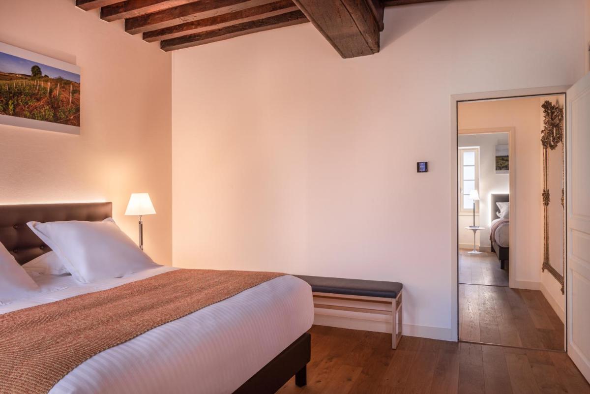 Un ou plusieurs lits dans un hébergement de l'établissement L'Hôtel