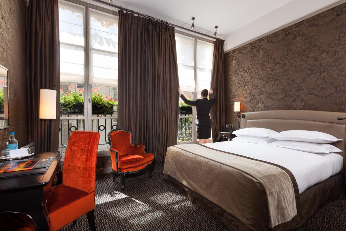 Un ou plusieurs lits dans un hébergement de l'établissement Le Pavillon de la Reine & Spa, Place des Vosges