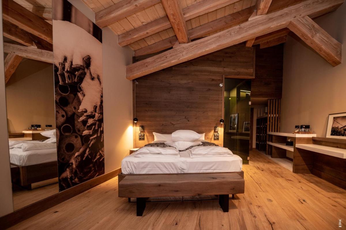 Un ou plusieurs lits dans un hébergement de l'établissement Chalet Hôtel & Spa Le Collet