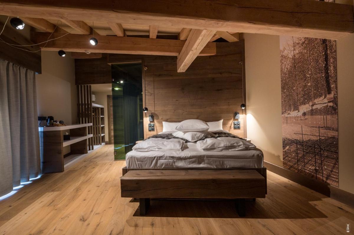 Un ou plusieurs lits dans un hébergement de l'établissement Chalet Hôtel & Spa Le Collet
