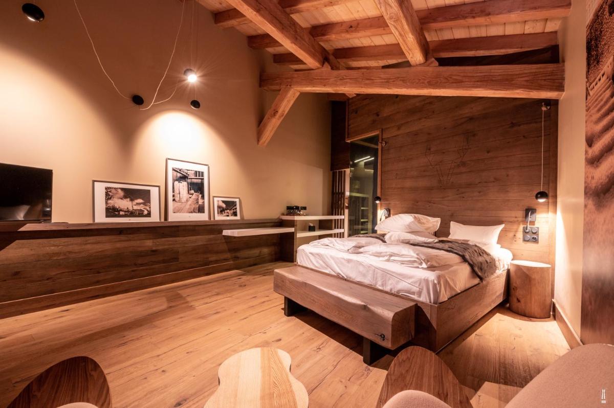 Un ou plusieurs lits dans un hébergement de l'établissement Chalet Hôtel & Spa Le Collet