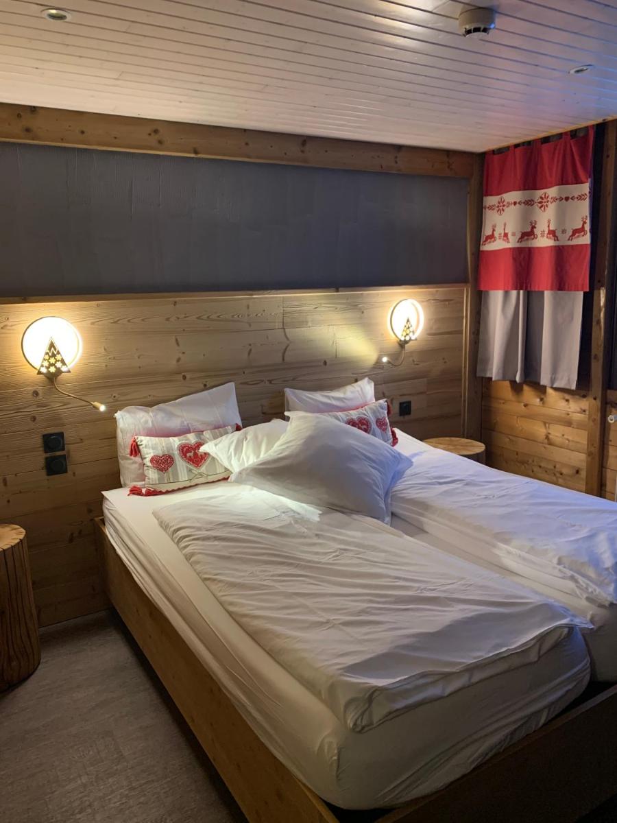 Un ou plusieurs lits dans un hébergement de l'établissement Chalet Hôtel & Spa Le Collet