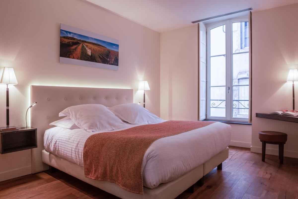Un ou plusieurs lits dans un hébergement de l'établissement L'Hôtel