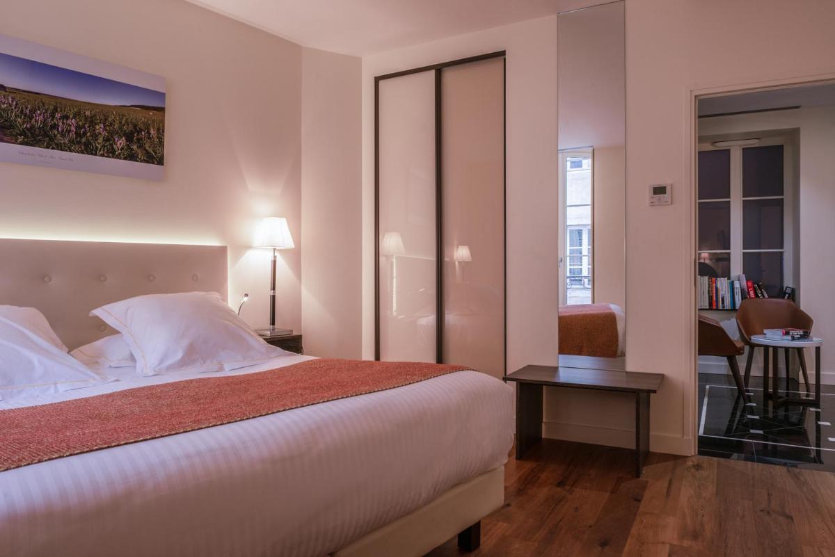 Un ou plusieurs lits dans un hébergement de l'établissement L'Hôtel