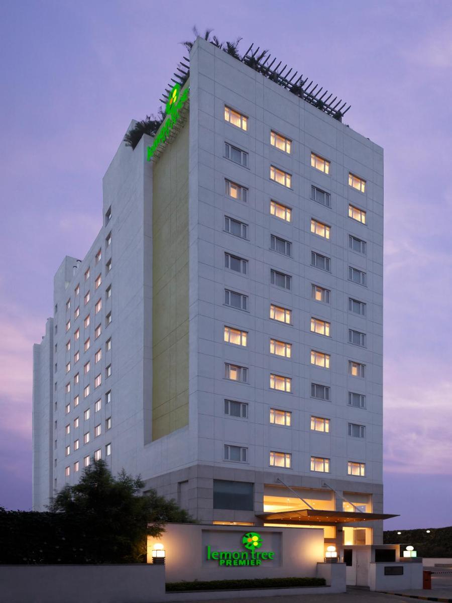 a tall white building with a hotel sign on it at Lemon Tree Premier, Ulsoor Lake, Bengaluru in Bengaluru