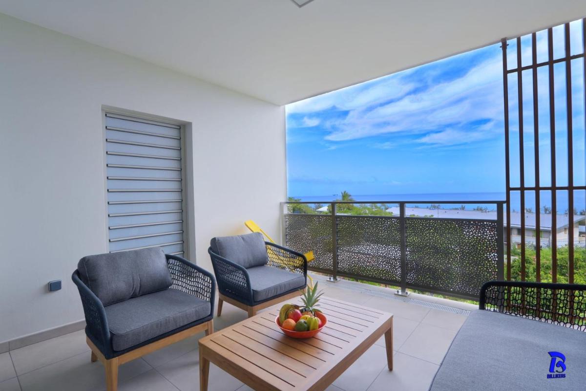 Appt Neuf Leu EMRA est un T2 situé à Saint-Leu avec balcon vue mer - Housity
