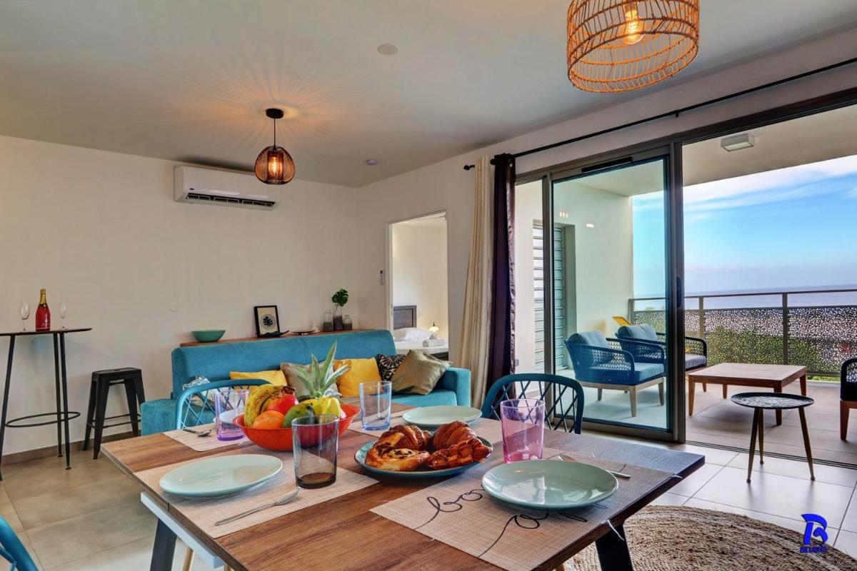 Appt Neuf Leu EMRA est un T2 situé à Saint-Leu avec balcon vue mer - Housity