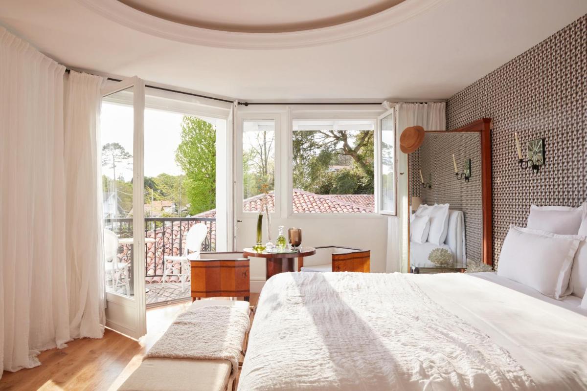 Un ou plusieurs lits dans un hébergement de l'établissement Brindos, Lac & Château - Relais & Châteaux - Anglet Biarritz