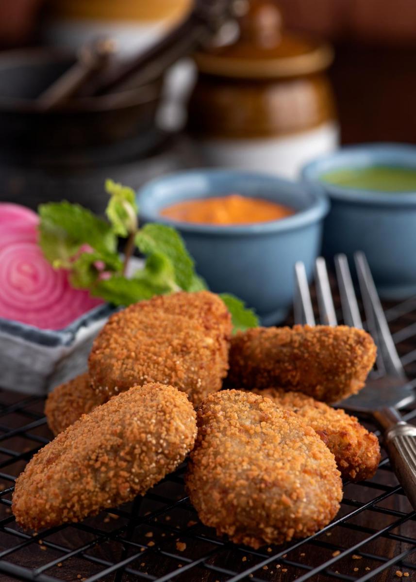 a bunch of food sitting on a cooling rack at Radisson Blu Plaza Delhi Airport in New Delhi a bunch of food sitting on a cooling rack at Radisson Blu Plaza Delhi Airport in New Delhi