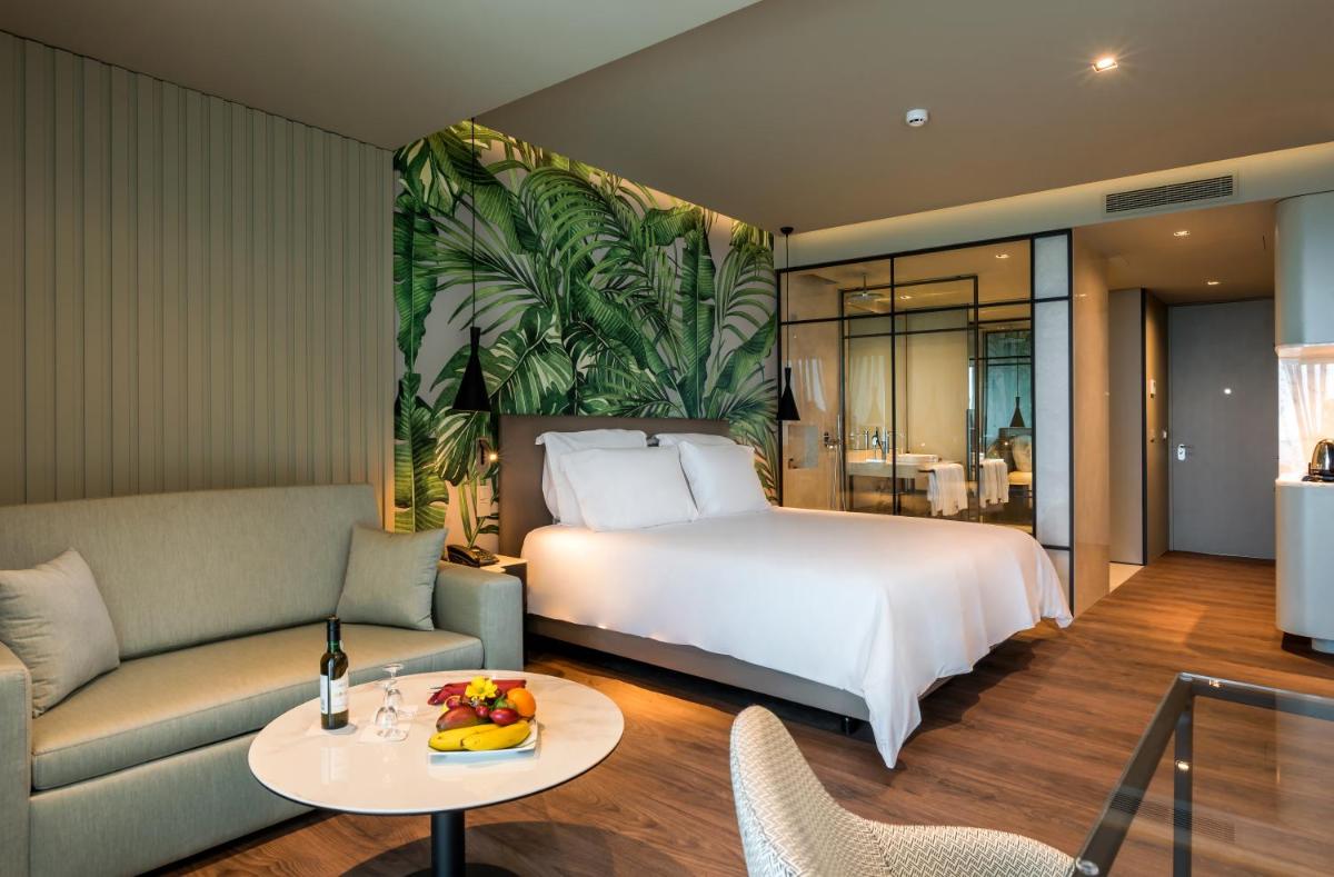 Uma cama ou camas num quarto em TUI Blue Gardens - Adults-only - Savoy Signature