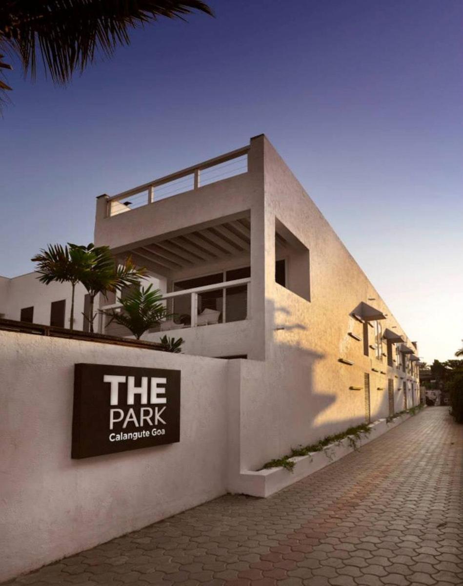 a building with a sign on the side of it at The Park Calangute Goa in Calangute a building with a sign on the side of it at The Park Calangute Goa in Calangute