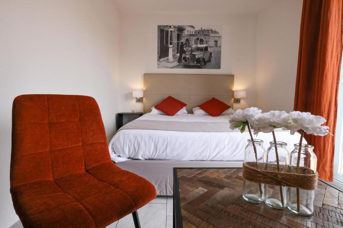 Un ou plusieurs lits dans un hébergement de l'établissement Hôtel Casa Rossa & Spa
