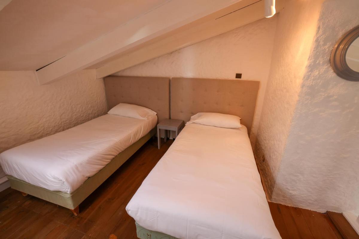 Un ou plusieurs lits dans un hébergement de l'établissement Hôtel Casa Rossa & Spa