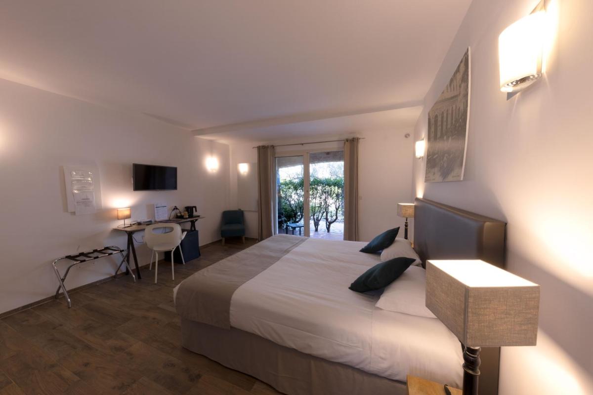 Un ou plusieurs lits dans un hébergement de l'établissement Hôtel Casa Rossa & Spa