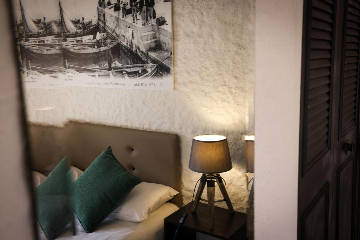 Un ou plusieurs lits dans un hébergement de l'établissement Hôtel Casa Rossa & Spa