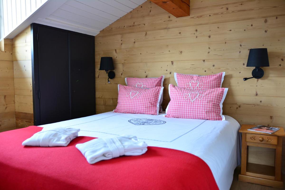Un ou plusieurs lits dans un hébergement de l'établissement Café-Hôtel Le Morillon, Domaine du Grand Massif-Samoëns