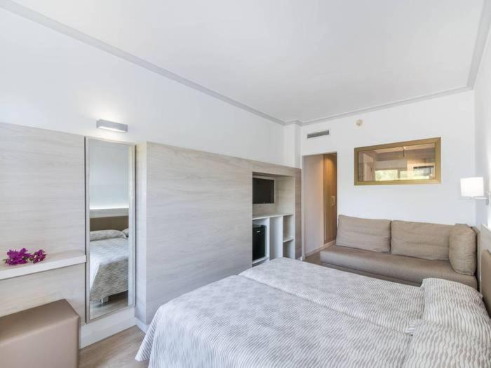 Cama o camas de una habitación en Hotel Na Taconera