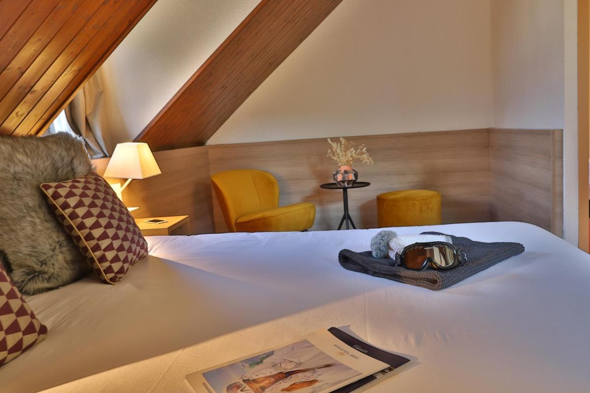 Un ou plusieurs lits dans un hébergement de l'établissement SOWELL HOTELS Mont Blanc et SPA