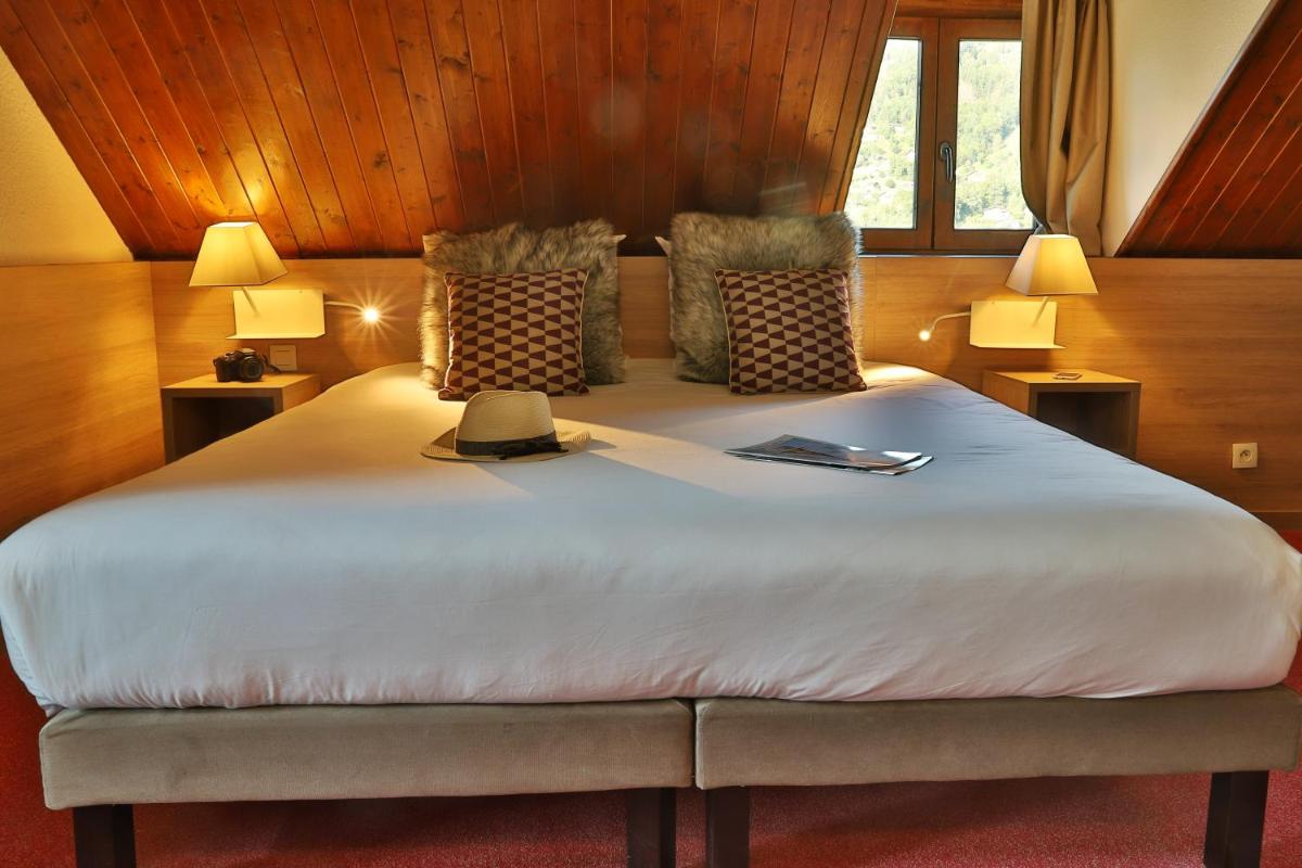 Un ou plusieurs lits dans un hébergement de l'établissement SOWELL HOTELS Mont Blanc et SPA