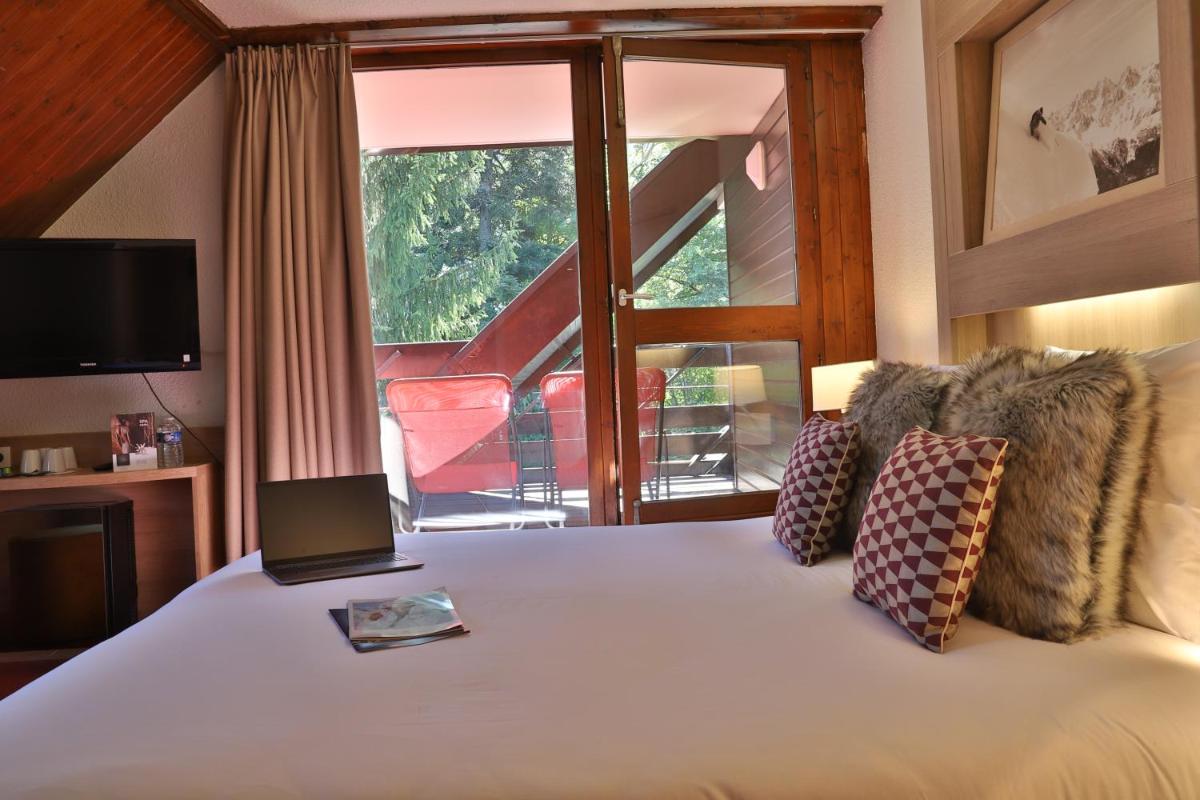 Un ou plusieurs lits dans un hébergement de l'établissement SOWELL HOTELS Mont Blanc et SPA