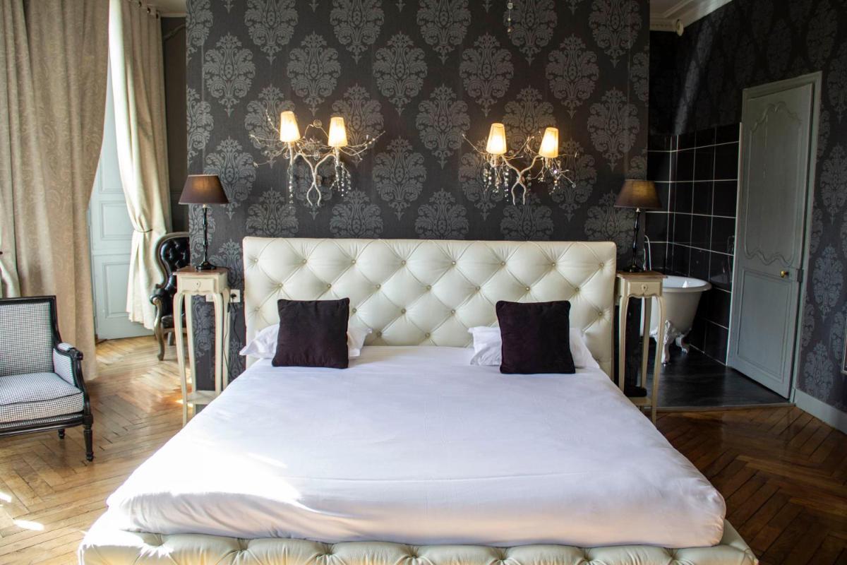 Un ou plusieurs lits dans un hébergement de l'établissement Hôtel 4 étoiles - Restaurants & Spa Périer Du Bignon
