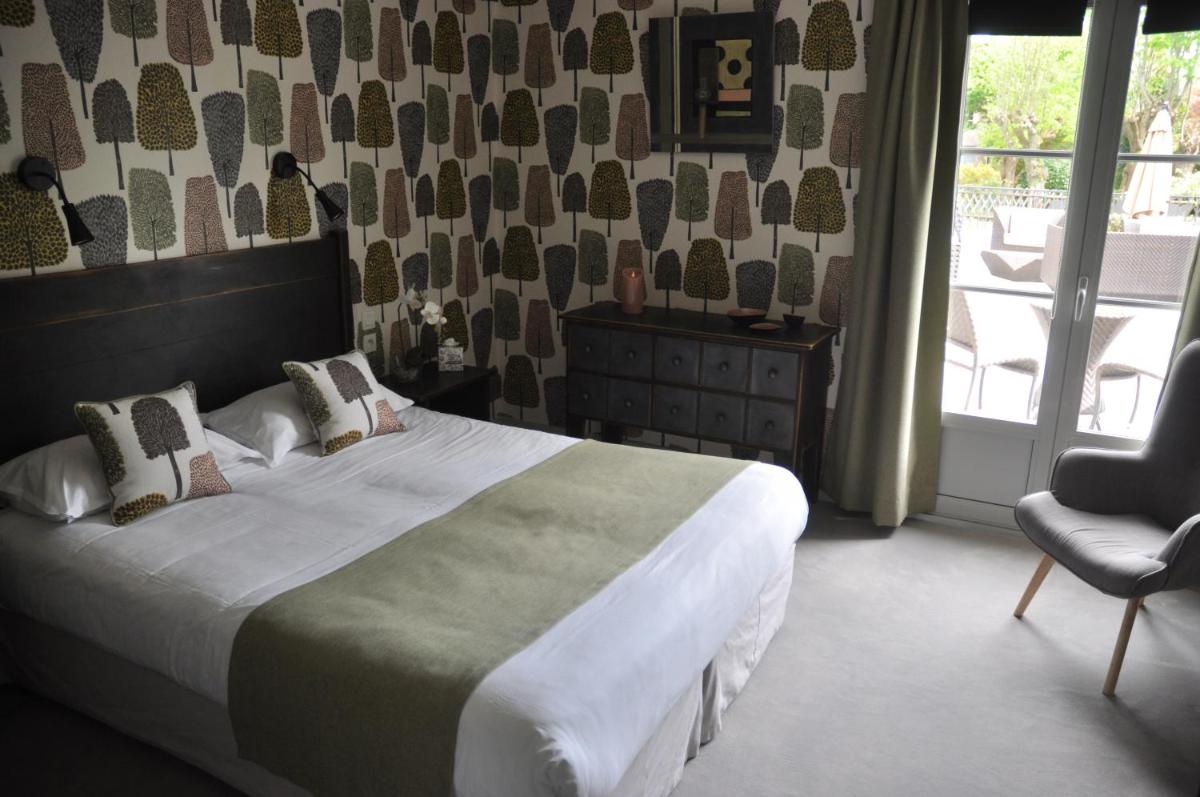 Un ou plusieurs lits dans un hébergement de l'établissement Hôtel 4 étoiles - Restaurants & Spa Périer Du Bignon