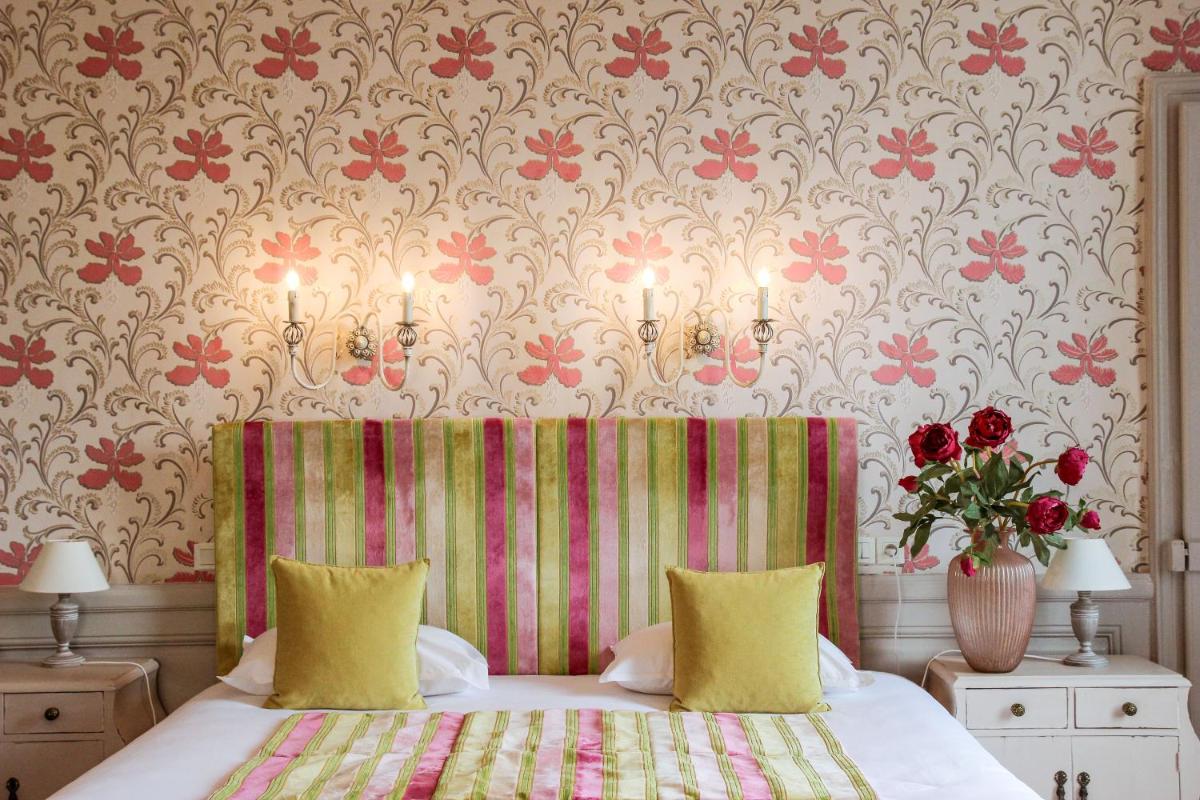 Un ou plusieurs lits dans un hébergement de l'établissement Hôtel 4 étoiles - Restaurants & Spa Périer Du Bignon