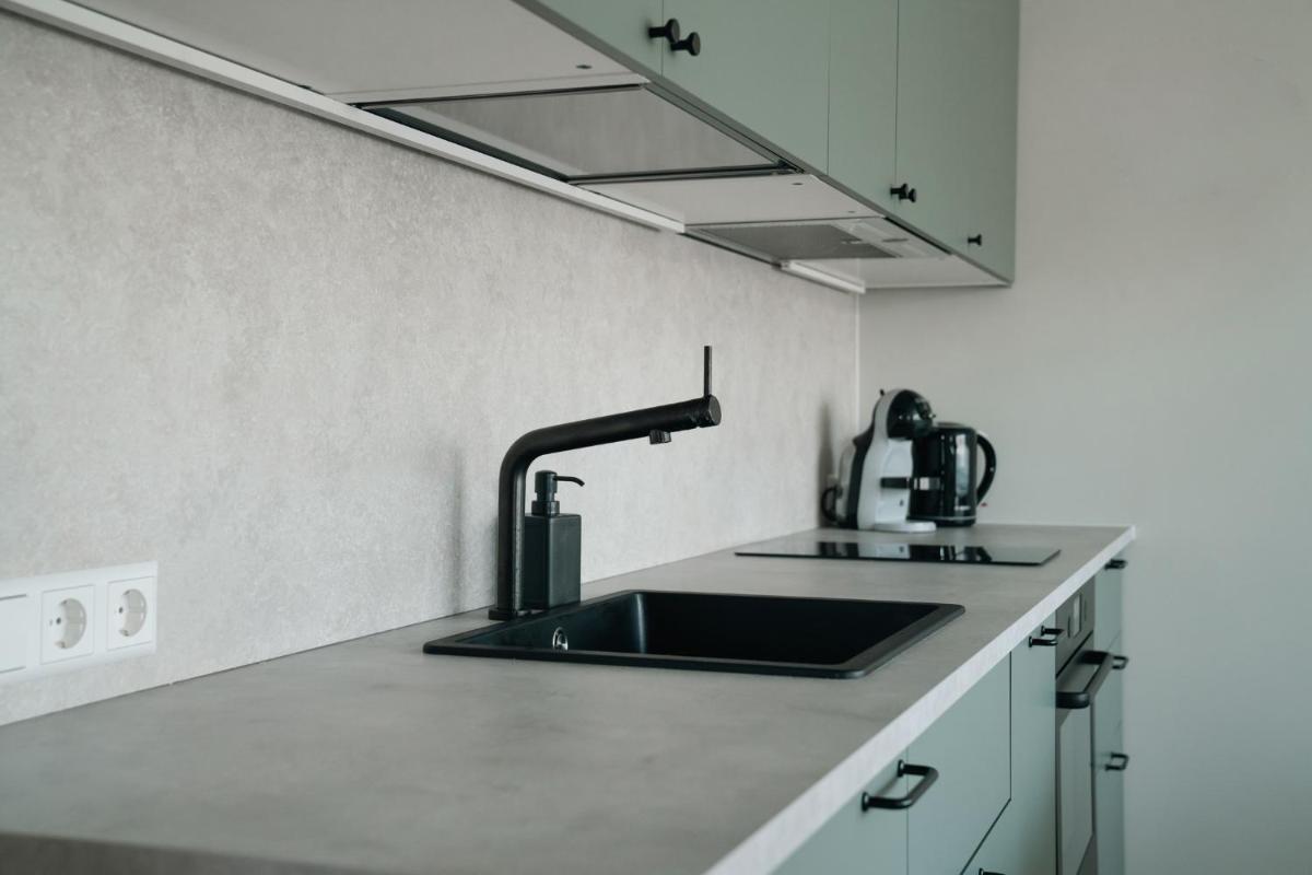 Grey Green Cozy Apartment - Housity