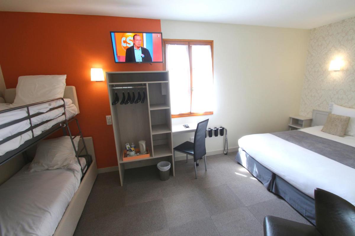 Un ou plusieurs lits dans un hébergement de l'établissement Logis Hotel Archambeau